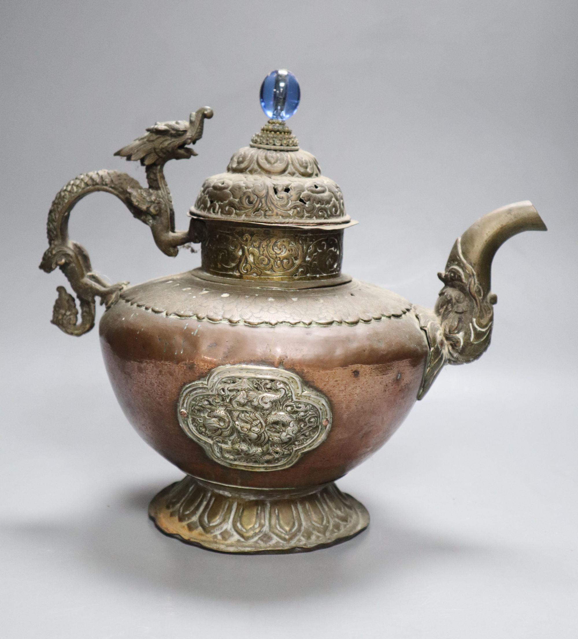 A 19th century Tibetan duomuhu ewer and a teapot, tallest 31cm